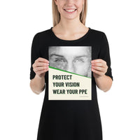 An eye safety poster of a black and white close up of a man's eyes looking intently forward with a safety slogan in blue text below.