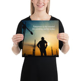 A safety poster showing a worker on a construction site being silhouetted by a sunset of orange and blue colors with the slogan tomorrow is the reward for working safely today.