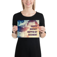 Safety poster showing a close up of 3 hands wearing gloves holding glass beakers and a safety slogan written in bottom right corner.