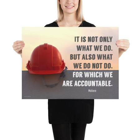 Safety poster showing a bright red hard hat sitting on concrete with sunny sky in background and a safety quote written in bold letters.