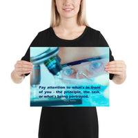 Workplace safety poster of a close up of a woman's eyes wearing safety glasses inspecting a sample on a microscope with safety quote written at the bottom.