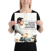 A workplace safety poster of a man in safety glasses and earmuffs taking a break in his woodshop with a safety slogan to the right.
