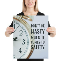 A workplace safety poster showing a close-up of a clock face with the slogan don't be hasty when it comes to safety.