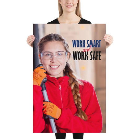A workplace safety poster showing a warehouse worker wearing gloves and safety glasses and holding a broom and smiling with the slogan work smart and work safe.