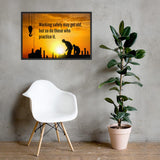 A workplace safety poster showing a construction site and construction workers being silhouetted by a bright and beautiful sunset of different shades of orange with the slogan working safely may get old, but so do those who practice it.