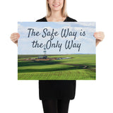 A safety poster showing an oil rig in a beautiful landscape scene of a field with vivid green grass and a bright blue sky with the slogan the safe way is the only way.