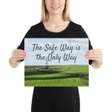 A safety poster showing an oil rig in a beautiful landscape scene of a field with vivid green grass and a bright blue sky with the slogan the safe way is the only way.