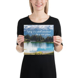 A workplace safety poster depicting a beautiful pond in the foreground, lush evergreens in the middle ground and snow-capped mountains in the background with text saying safety is a small investment for a rich future.