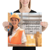 Safety poster showing a female warehouse worker smiling and wearing an orange reflective safety vest and orange hard hat with a safety quote written in dark text.