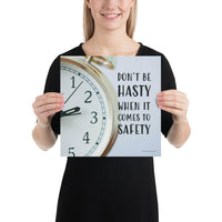 A workplace safety poster showing a close-up of a clock face with the slogan don't be hasty when it comes to safety.