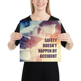 Safety poster showing a close up of 3 hands wearing gloves holding glass beakers and a safety slogan written in bottom right corner.