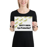 An eye safety poster depicting many clear safety glasses with yellow trim neatly lined up in rows and rows with a safety slogan in the foreground.