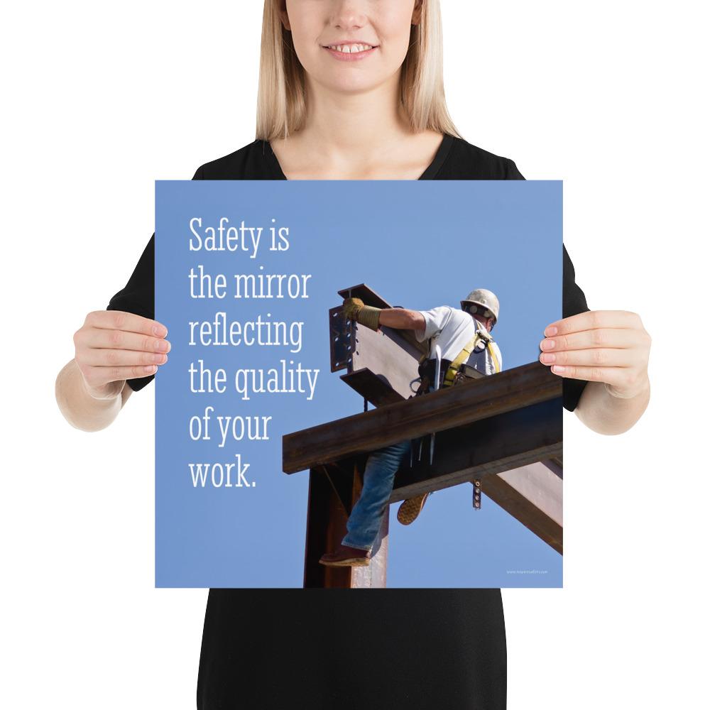 A workplace safety poster showing a construction ironworker on steel beams in a hardhat and safety harness with a bright blue sky in the background with the slogan safety is the mirror reflecting the quality of your work.