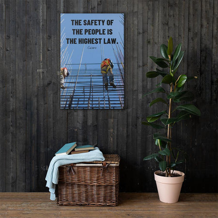 A safety poster showing construction workers scaling rebar with a bright blue sky as the background and a safety quote in black block text.