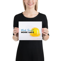 A safety poster showing a close-up of a yellow hard hat on a white background with the slogan work smart and work safe.