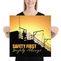 A workplace safety poster showing a construction site and construction workers being silhouetted by a bright and beautiful sunset of different shades of orange with the slogan safety first, safety always.