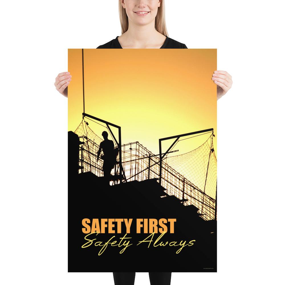 A workplace safety poster showing a construction site and construction workers being silhouetted by a bright and beautiful sunset of different shades of orange with the slogan safety first, safety always.