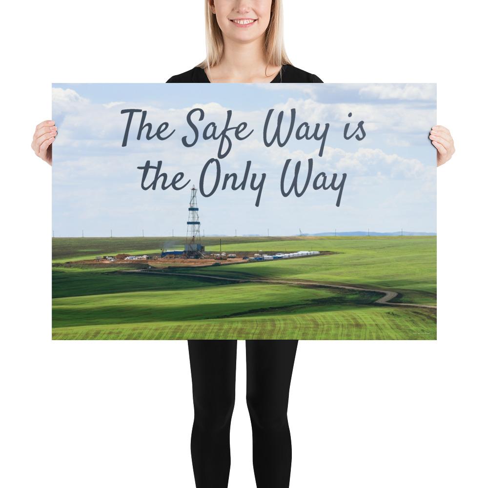 A safety poster showing an oil rig in a beautiful landscape scene of a field with vivid green grass and a bright blue sky with the slogan the safe way is the only way.