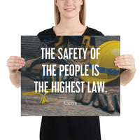 A safety poster showing a close-up of various PPE including safety glasses, ear muffs, gloves, a hard hat, and work boots with the quote by Cicero in the foreground.