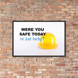 A workplace safety poster showing a yellow hard hat on a plain white background with the slogan were you safe today, or just lucky?