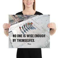 A workplace safety poster showing an aerial view of construction workers in reflective vests standing in a line on top of a building with their shadows being cast on the building with the quote no one is wise enough by themselves by Plautus.