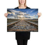 A workplace safety poster depicting old railroad tracks leading into a cloudy horizon with the text safety is a continuing journey, not a final destination.