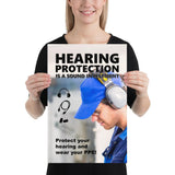 An ear safety poster showing a close up of a man's profile wearing ear muffs and safety glasses with a safety slogan and infographics of hearing PPE all around him.