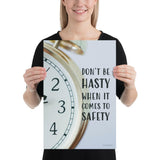 A workplace safety poster showing a close-up of a clock face with the slogan don't be hasty when it comes to safety.