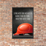 A workplace safety poster showing a bright red hard hat with an ominous black background with the slogan living with your mistakes is harder than you think, wear your safety gear.