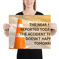 A workplace safety poster showing an orange safety cone with the slogan the near miss reported today is the accident that doesn't happen tomorrow.