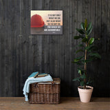 Safety poster showing a bright red hard hat sitting on concrete with sunny sky in background and a safety quote written in bold letters.