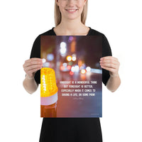 A workplace safety poster depicting a bright orange construction traffic light in the foreground of a blurry nighttime cityscape with a safety quote by William Blake.