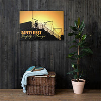 A workplace safety poster showing a construction site and construction workers being silhouetted by a bright and beautiful sunset of different shades of orange with the slogan safety first, safety always.
