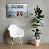 A safety poster showing two workers in reflective vests collaborating on a construction site with the proverb to know the road ahead ask those coming back.