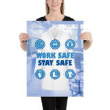 A workplace safety poster showing a blurred blue tinted lab in the background with a bright white lab coat and different blue infographic bubbles of PPE around the slogan work safe, stay safe.