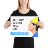A safety poster showing a close-up of a worker wearing safety glasses, a hard hat, and earplugs with the slogan prevention is better than cure, wear your PPE.