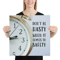 A workplace safety poster showing a close-up of a clock face with the slogan don't be hasty when it comes to safety.