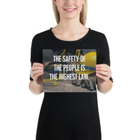 A safety poster showing a close-up of various PPE including safety glasses, ear muffs, gloves, a hard hat, and work boots with the quote by Cicero in the foreground.