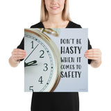 A workplace safety poster showing a close-up of a clock face with the slogan don't be hasty when it comes to safety.