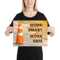 A safety poster showing a close-up of an orange traffic cone with the slogan work smart and work safe.
