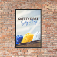 A workplace safety poster showing a white, a yellow, and a blue hardhat sitting on a wall with the slogan safety first, safety always.
