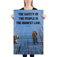 A safety poster showing construction workers scaling rebar with a bright blue sky as the background and a safety quote in black block text.
