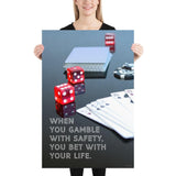 A workplace safety poster of a glossy black table with red dice, playing cards, and poker chips strewn everywhere with a safety slogan in the bottom left corner.