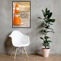 A workplace safety poster showing an orange safety cone with the slogan the near miss reported today is the accident that doesn't happen tomorrow.