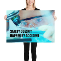 Safety poster of a close up of a woman's eyes wearing safety glasses inspecting a sample on a microscope with safety slogan written at the bottom.