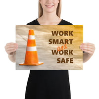 A safety poster showing a close-up of an orange traffic cone with the slogan work smart and work safe.