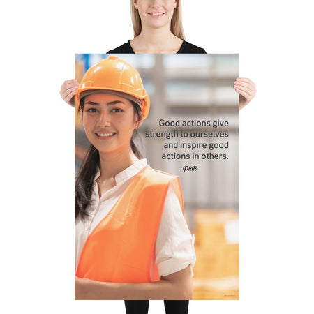 Safety poster showing a female warehouse worker smiling and wearing an orange reflective safety vest and orange hard hat with a safety quote written in dark text.
