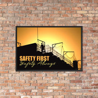 A workplace safety poster showing a construction site and construction workers being silhouetted by a bright and beautiful sunset of different shades of orange with the slogan safety first, safety always.