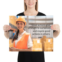 Safety poster showing a female warehouse worker smiling and wearing an orange reflective safety vest and orange hard hat with a safety quote written in dark text.