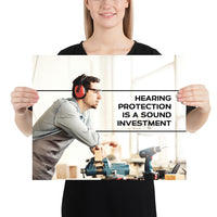 A workplace safety poster of a man in safety glasses and earmuffs taking a break in his woodshop with a safety slogan to the right.